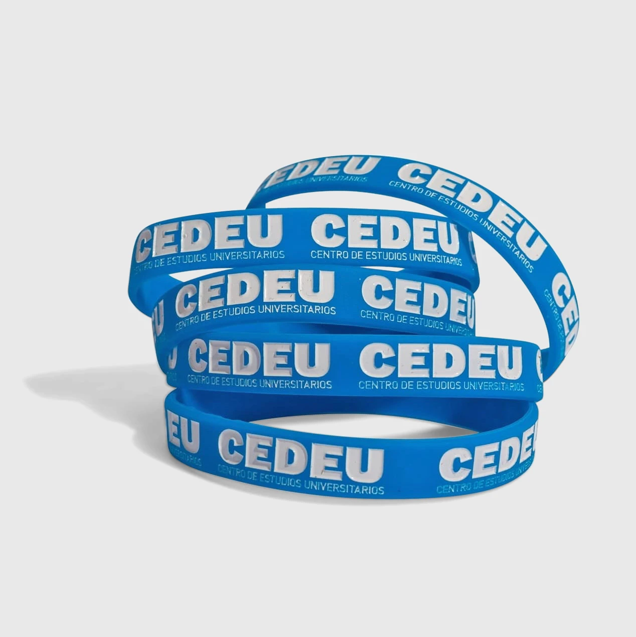 Pulseras de silicona personalizadas bajo relieve con color personalizado con logo de empresa - Wyapromo